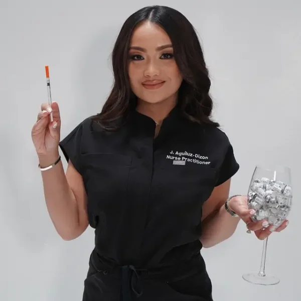 Jenesa Aguiluz-Dizon holding a syringe and a glass of cosmetic vials at iCare Medical Clinic.