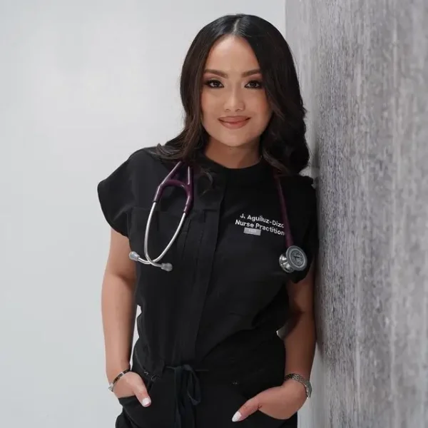 Jenesa Aguiluz-Dizon, Nurse Practitioner at iCare Medical Clinic wearing black scrubs.